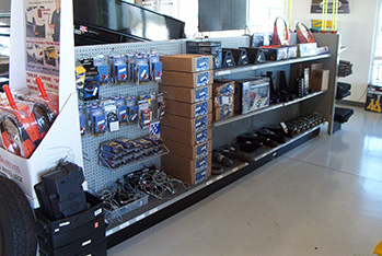 Trailer parts and accessories sitting on a shelf in a store.